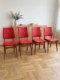 Lot de quatre chaises de salle à manger vintage « Chaises skai » des années 1960, en bois, avec assise et dossier rouges. Brocante 93