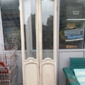 Portes d'ascenseur datant de 1940, dotées de vitres cintrées de style Art déco et de sculptures raffinées. Brocante 93